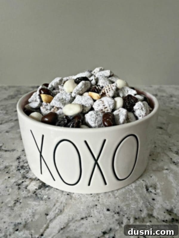 Tuxedo Muddy Buddies in a Rae Dunn XOXO bowl