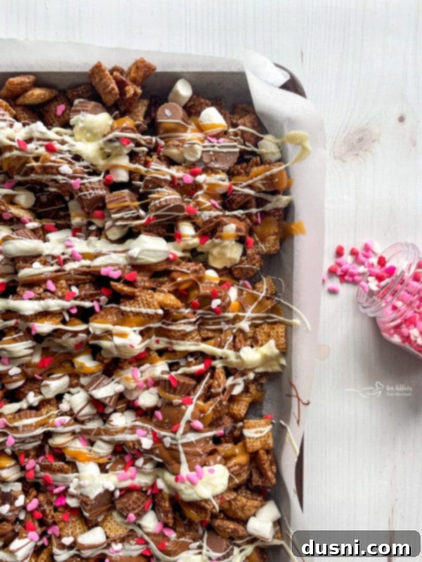 Step 7: Sprinkling sea salt over the wet Chex mix.