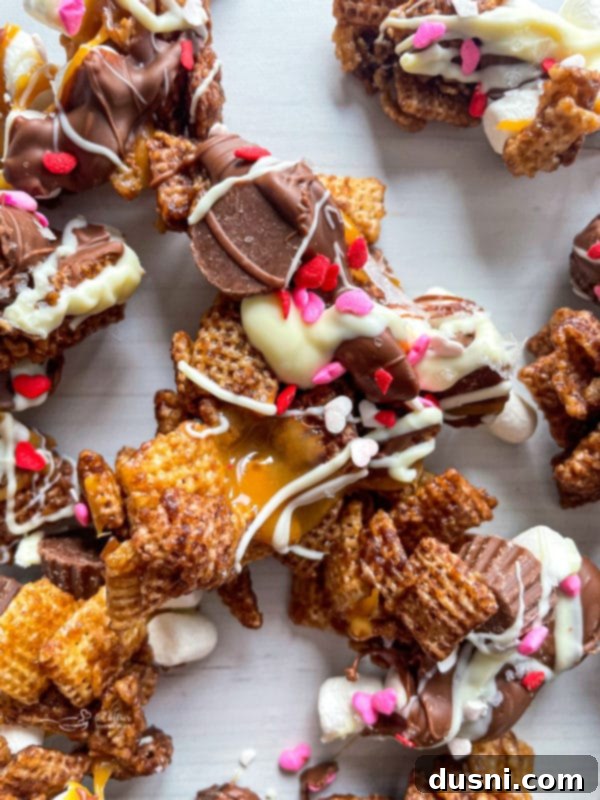 Hand reaching for a piece of Better Than Sex Chex Mix, highlighting its addictive quality.