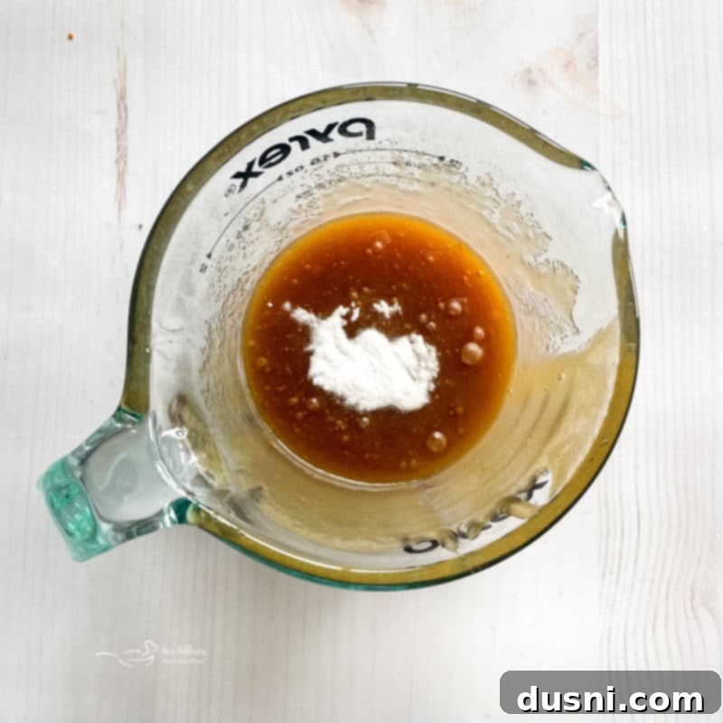 Step 1: Pouring Chex cereal into a bowl.