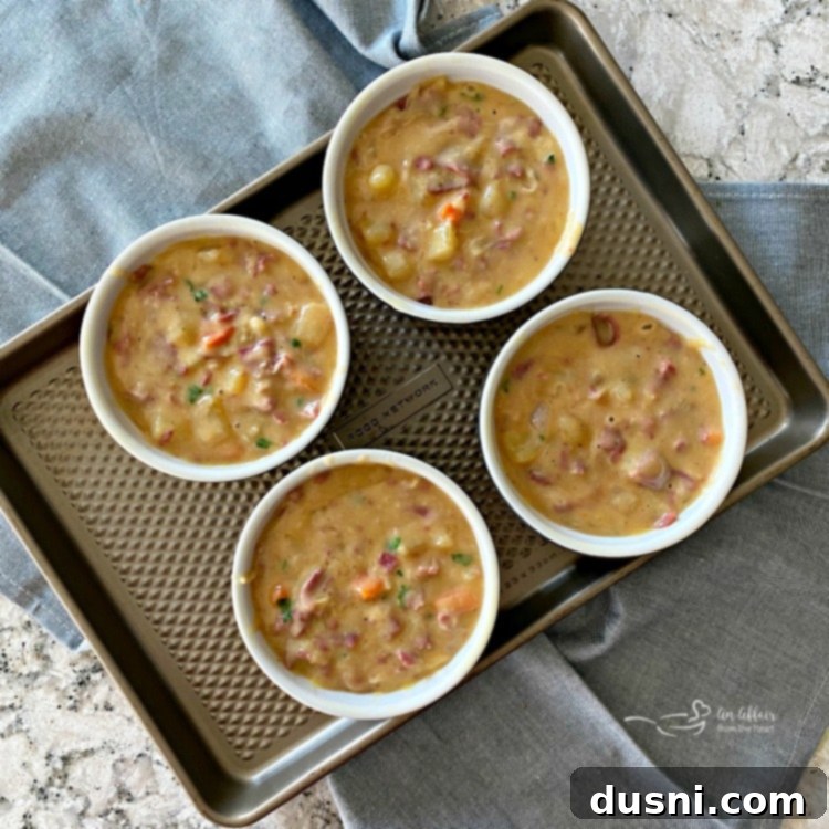 Filling ramekins with hot Reuben Pot Pie mixture.