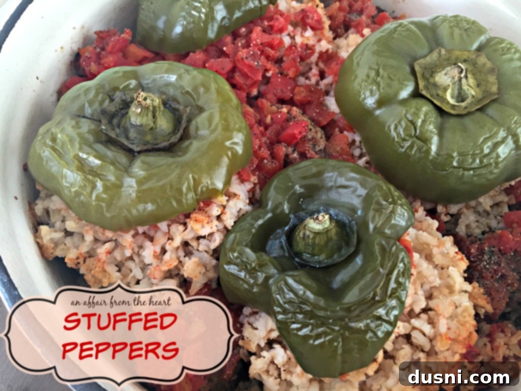 A large pan filled with baked stuffed peppers, highlighting the rich, savory filling and tender peppers.