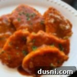 Fiesta Pork Chops 14 close up Taco Pork Chops on a white serving plate