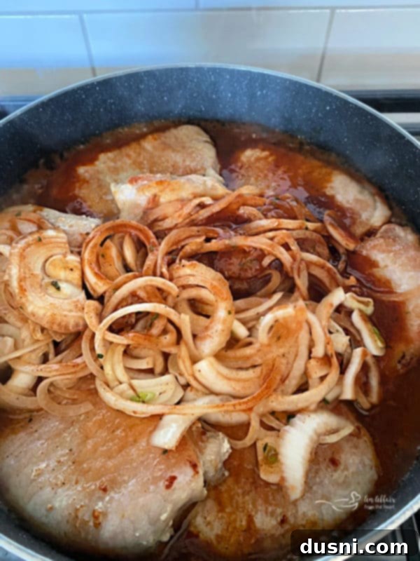 Fiesta Pork Chops 8 Taco Pork Chops simmering in sauce