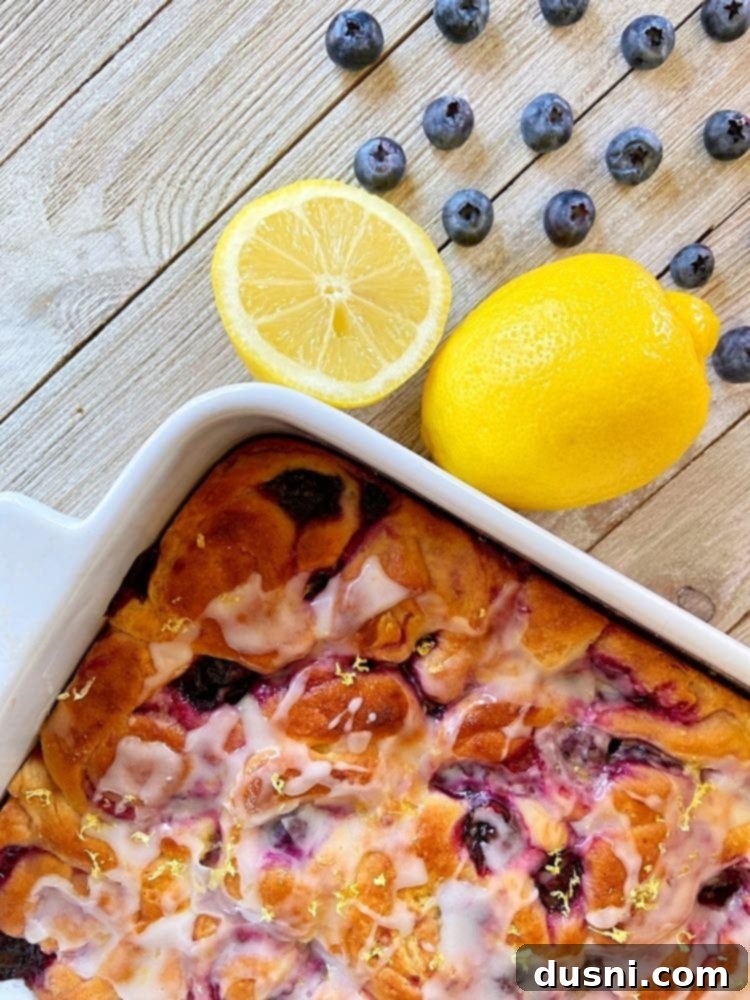 Sunshine Lemon Blueberry Rolls 2 Lemon Blueberry Sweet Rolls, freshly baked and glazed, perfect for brunch
