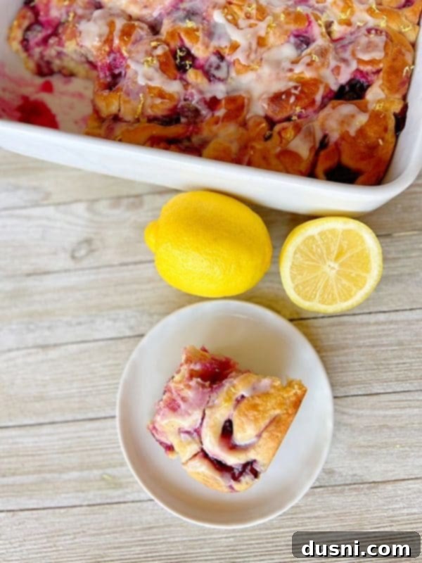 Sunshine Lemon Blueberry Rolls 4 Close-up of freshly baked Lemon Blueberry Sweet Rolls with lemon glaze