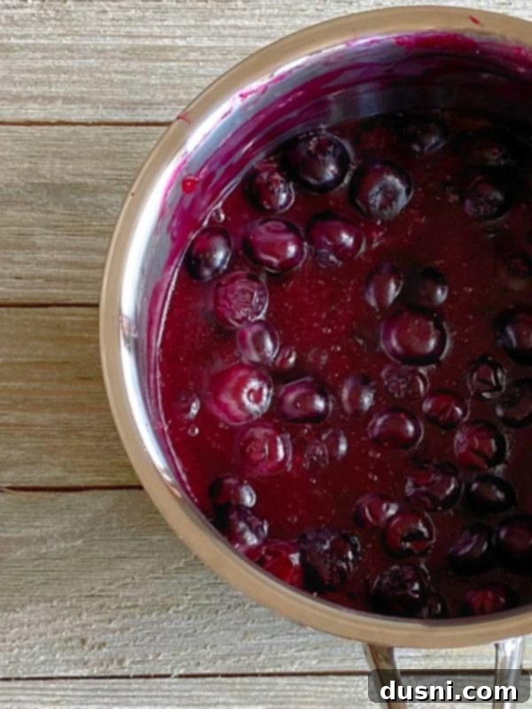 Sunshine Lemon Blueberry Rolls 7 Blueberry filling cooking in a saucepan