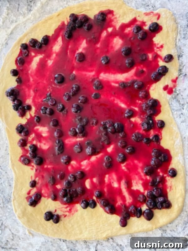 Sunshine Lemon Blueberry Rolls 9 Blueberry filling spread over rolled dough