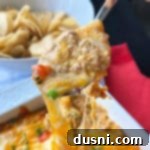 Hot Taco Five Bean Dip on a spoon