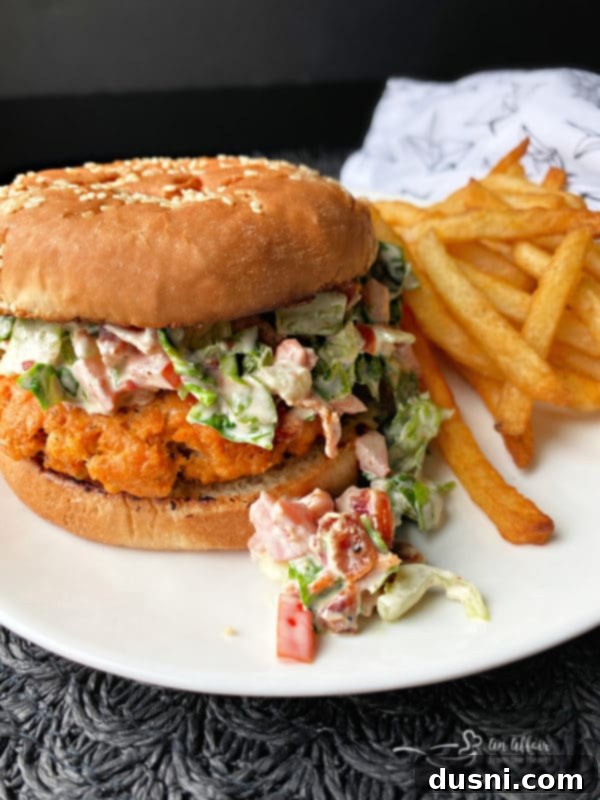 Blackened Salmon Patties and Zesty BLT Slaw 2 Delicious blackened salmon burger topped with BLT slaw on a toasted bun