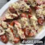 Grilled Kielbasa and Kraut 13 Top view of Grilled Polish Sausage and Sauerkraut white platter