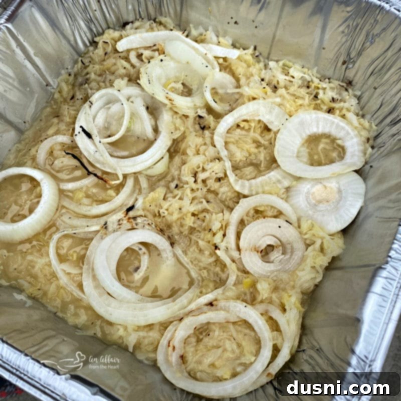 Grilled Kielbasa and Kraut 6 Sauerkraut mixture in an aluminum pan with spices