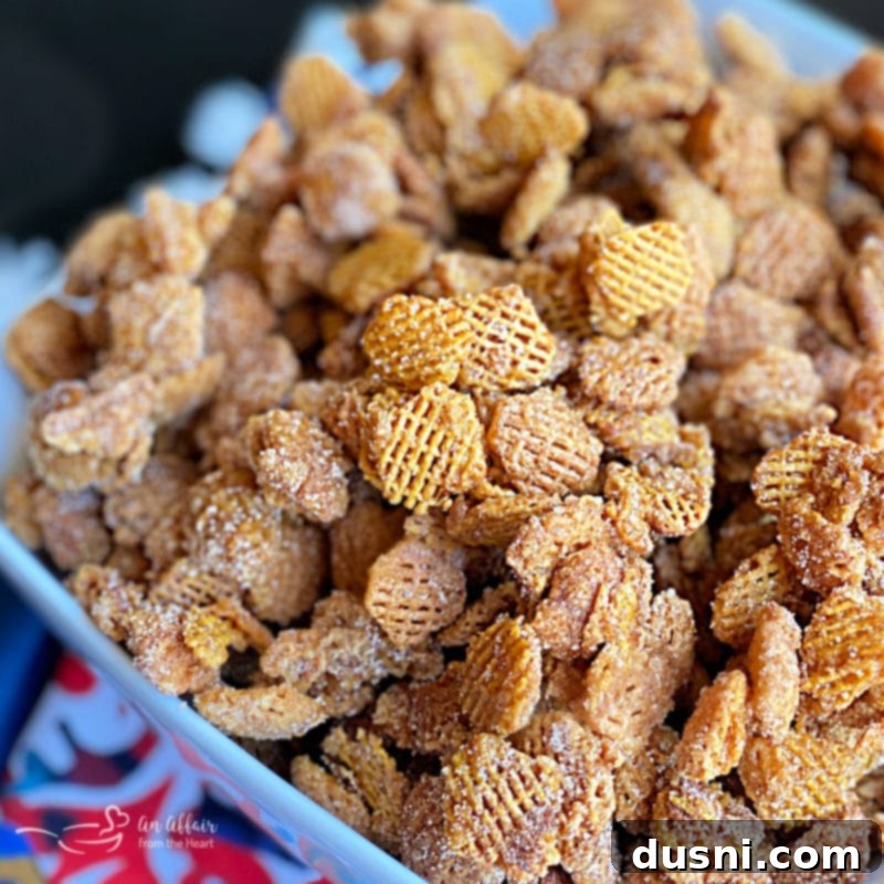 Close-up of golden Caramel Churro Chex Mix in a bowl