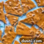 peanut brittle cracked on a marble surface