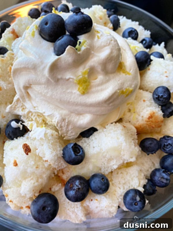 Close up of a spoonful of Lemon Blueberry Trifle