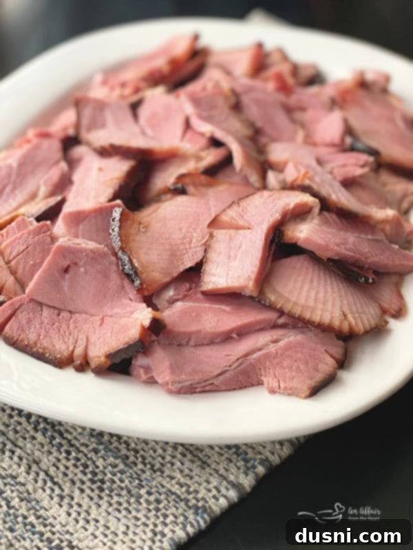 A beautifully glazed double smoked ham, glistening with sweet spiced glaze