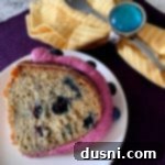 overhead of Blueberry Banana Bundt Cake slice on a white plate