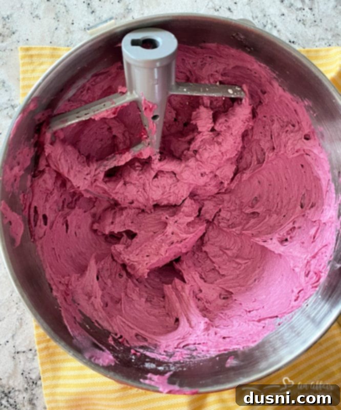 Fluffy Fresh Blueberry Buttercream Frosting in a bowl