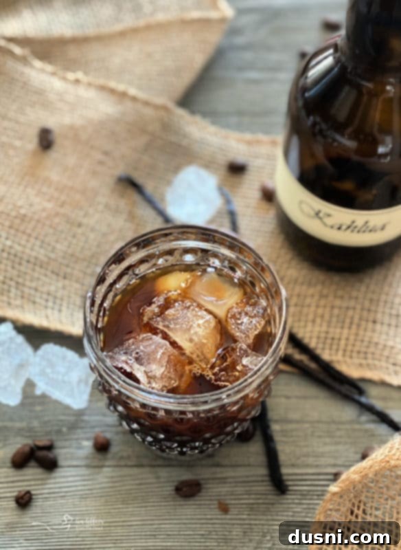 Three elegant bottles filled with homemade Kahlua, ready for storage or gifting.