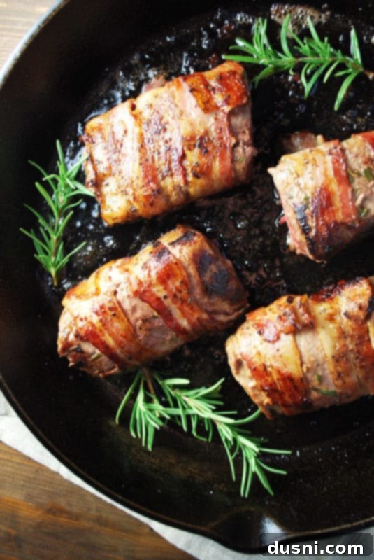 Bacon's Embrace: Recipes for Wrapped Perfection 11 Bacon-wrapped venison tenderloin, a gourmet game dish.
