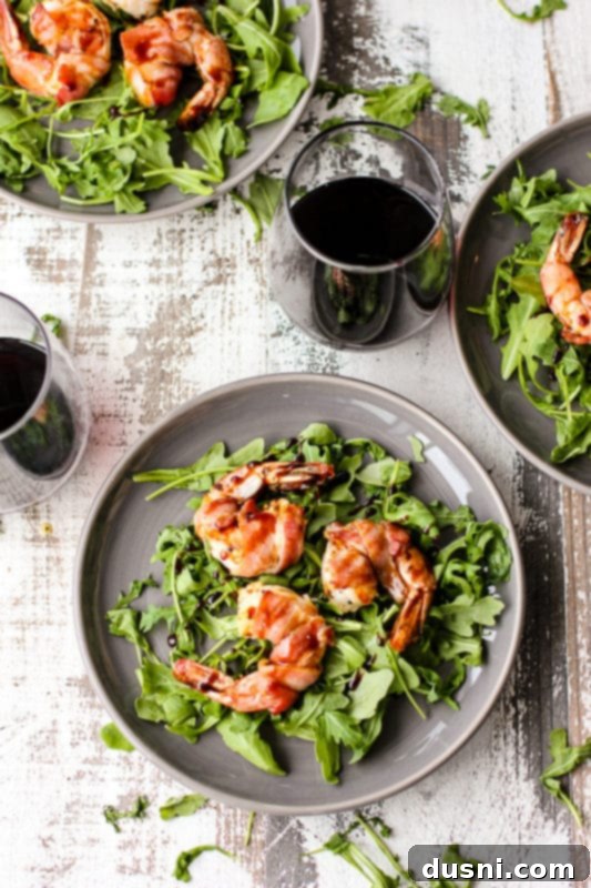 Bacon's Embrace: Recipes for Wrapped Perfection 12 Perfectly cooked bacon-wrapped shrimp, ready to serve.