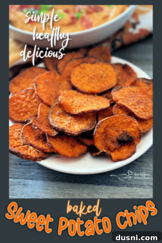 A bowl filled with freshly baked, crispy sweet potato chips, ready to be served.