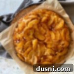 Overhead view of Apple Upside Down Cake on wooden platter