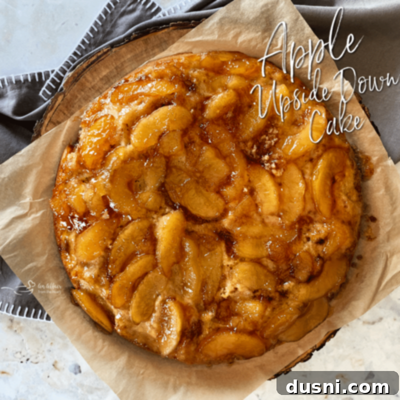 Close up of a whole Apple Upside Down Cake, highlighting its inviting texture and golden topping.
