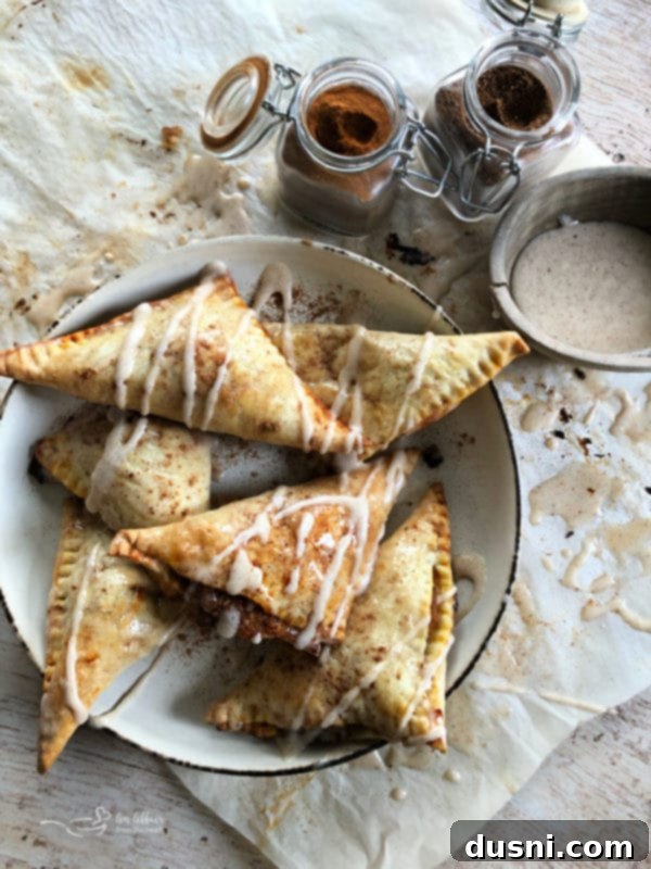 Pumpkin pie turnovers before baking, with filling visible
