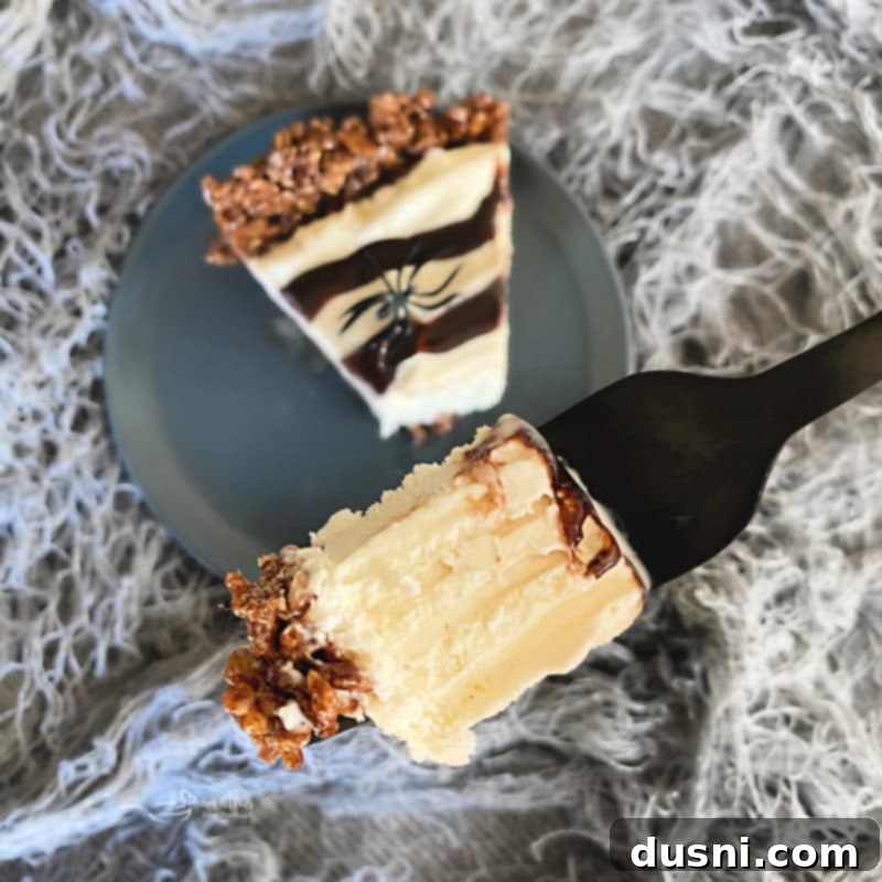 Spider Web Ice Cream Pie in a white pie dish, ready to be sliced