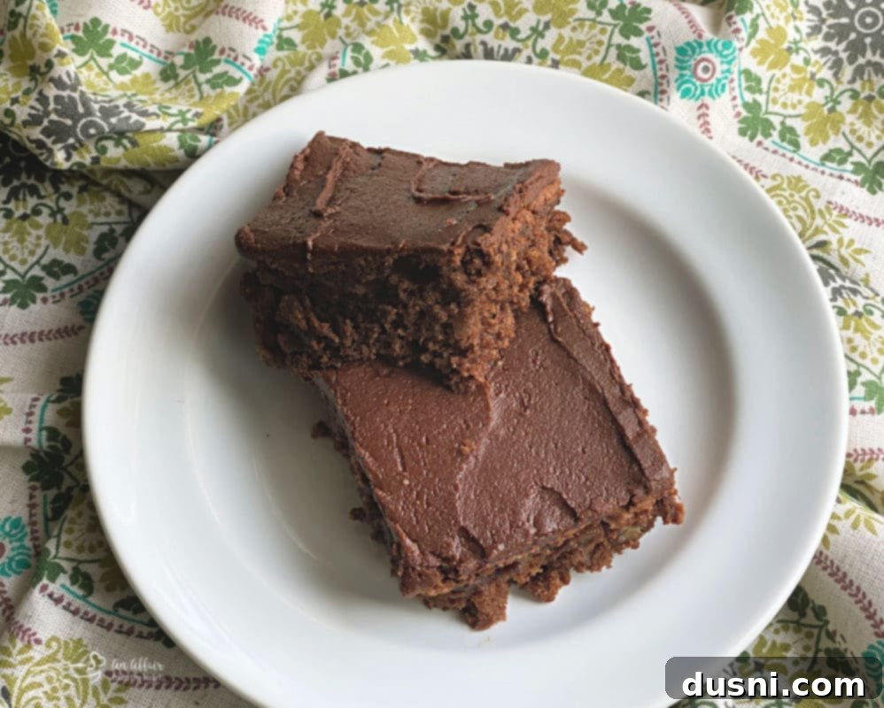 Ultimate Chocolate Banana Bars 4 Chocolate Banana Bars on a cooling rack, freshly frosted