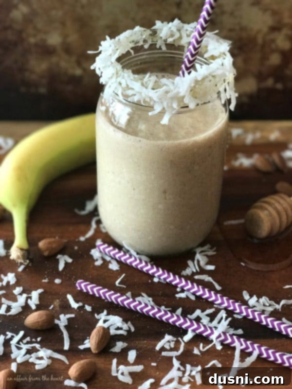Ultimate Chocolate Banana Bars 9 Nutty Monkey Smoothie in a glass with a straw