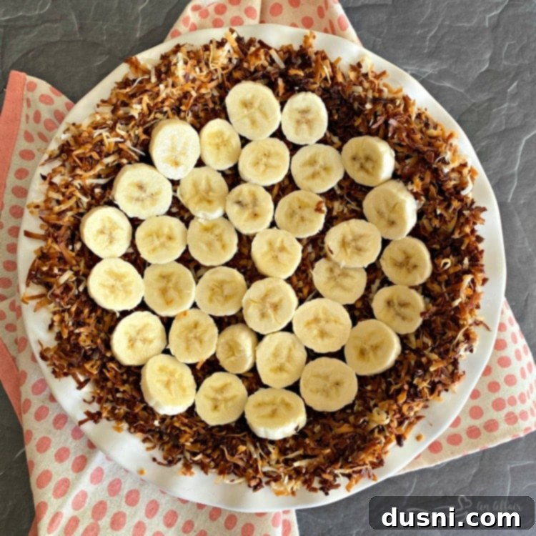 Arranging banana slices in a coconut pie crust