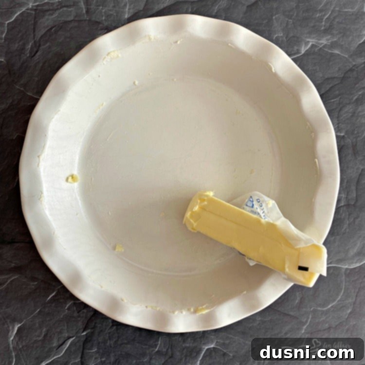 Butter a pie dish for a homemade pie