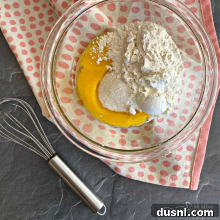 Mixing egg yolks, flour, cornstarch, and salt for custard