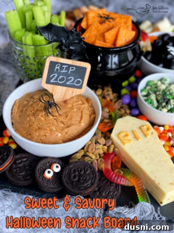 A Hauntingly Delicious Halloween Spread Sweet Savory and Peanut Butter Dip 11 The hero shot of the Sweet & Savory Halloween Snack Board, perfectly styled and ready for serving.