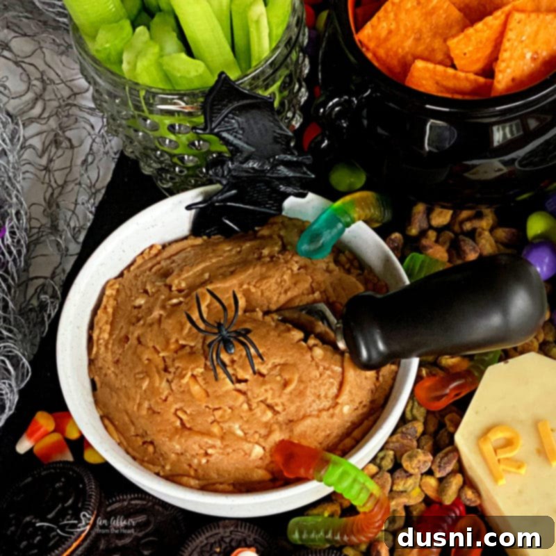 A Hauntingly Delicious Halloween Spread Sweet Savory and Peanut Butter Dip 7 Another close-up of the peanut butter dip, showing its creamy texture and bits of crunchy peanut, served in a decorative bowl.