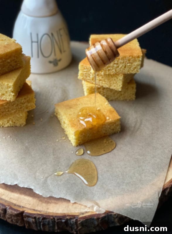 Fluffy Honey Cornbread Bliss 3 Homemade Honey Cornbread with a spoonful