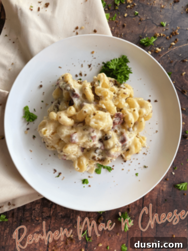 Reuben Mac 'n Cheese in a white serving dish, ready to be enjoyed.