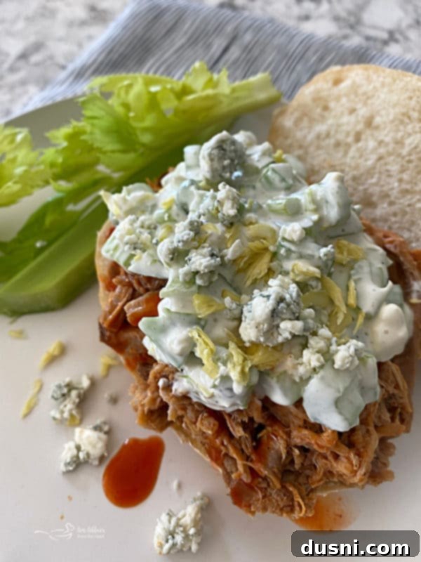 Spicy Slow Cooker Buffalo Pulled Pork with Cooling Celery Slaw 15 Finished Buffalo Pulled Pork Sandwich with Blue Cheese Celery Slaw