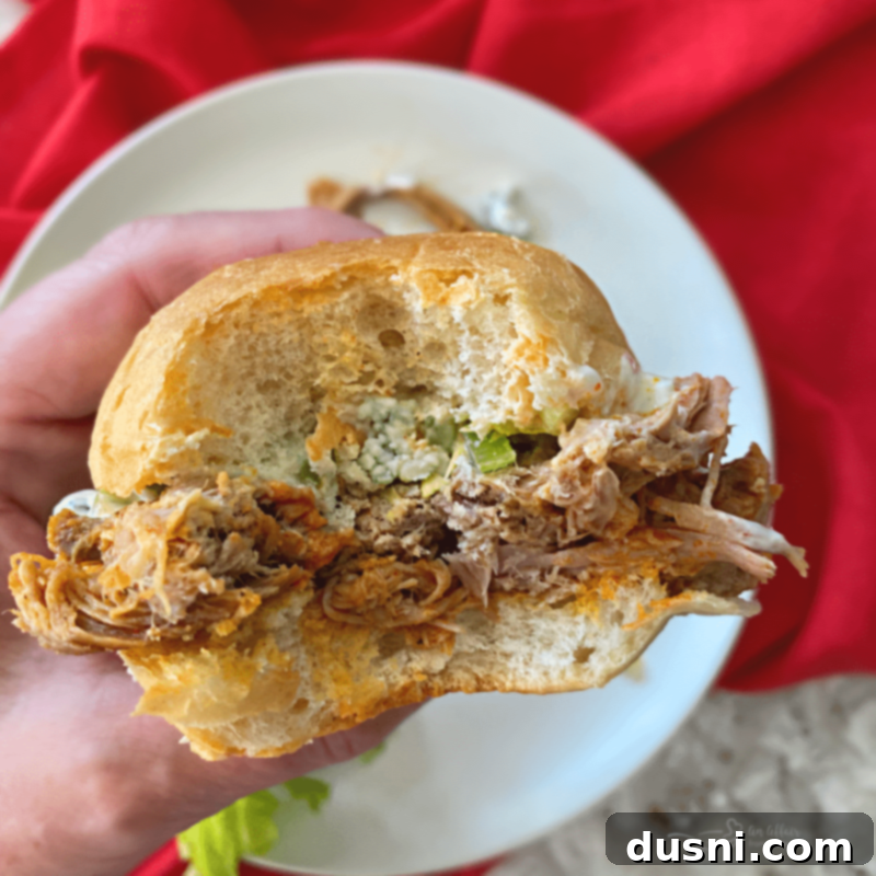 Spicy Slow Cooker Buffalo Pulled Pork with Cooling Celery Slaw 3 Plate of Buffalo Pulled Pork Sandwiches with Celery Slaw
