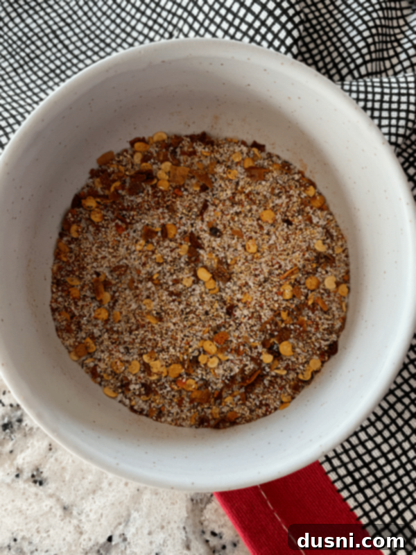 Spicy Slow Cooker Buffalo Pulled Pork with Cooling Celery Slaw 6 Applying dry rub to Boston Butt pork