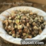 Mom's Pork Sausage and Sage Dressing 14 A decorative bowl filled with Grandma's Sausage & Sage Dressing, with text overlay.