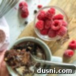 Easy Mug Brownie 13 bite of Mug Brownie In a light grey mug