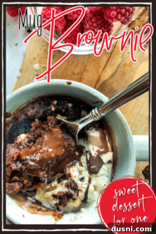 Easy Mug Brownie 9 Mug brownie with a bite taken out, showing the fudgy interior