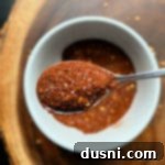 Homemade Chili Seasoning in white bowl with spoonful