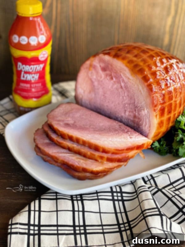Perfectly Glazed Slow Cooker Ham 3 Delicious glazed ham in a slow cooker, showcasing the rich, golden brown glaze.