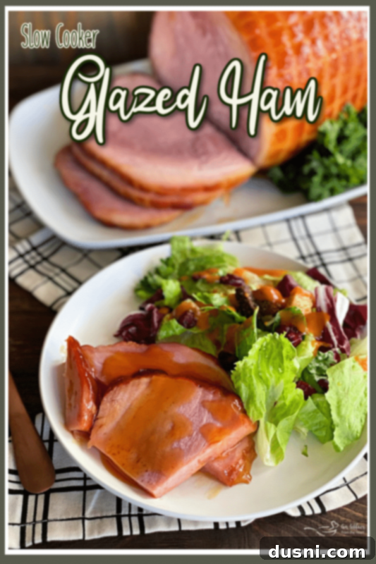 Perfectly Glazed Slow Cooker Ham 7 Sliced slow cooker glazed ham on a platter, ready to serve with extra glaze.