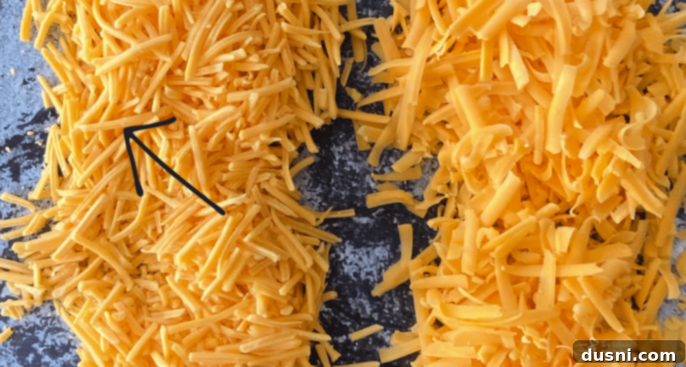 Why Freshly Grated Cheese Beats the Bag Every Time 5 Zoomed in view of shredded cheese with coating