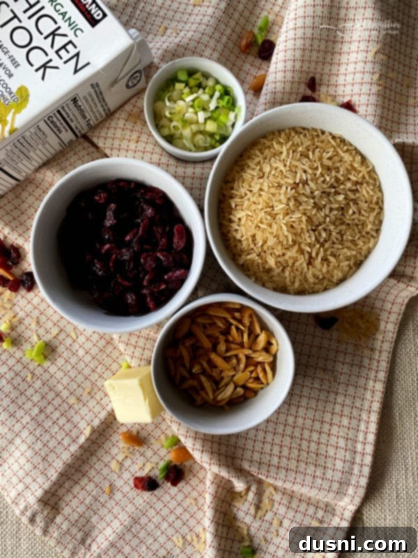 Ingredients for Rice Pilaf: converted rice, butter, slivered almonds, green onion, chicken stock, dried cranberries